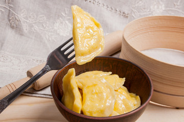 Close up view of boiled varenyky or dumpling with cottage cheese
