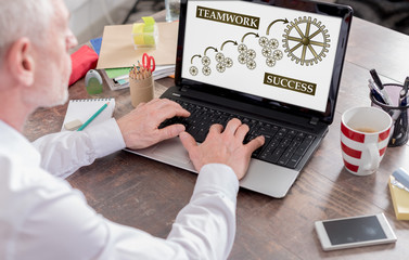 Teamwork success concept on a laptop screen