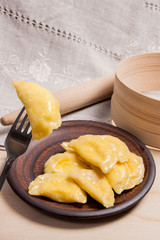Close up view of boiled varenyky or dumpling with cottage cheese