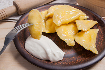 Close up view of boiled varenyky or dumpling with cottage cheese