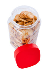 Jar of small appetizer crackers isolated on white background