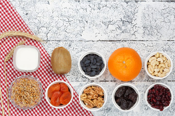 Yogurt on the table with different ingredients, snack