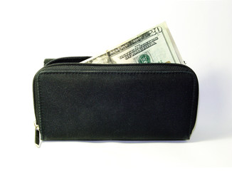 Money coming out of wallet. Cash in wallet purse.  Spending.