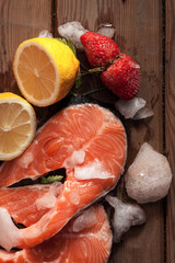 Salmon, Ice, Lemon And Strawberries