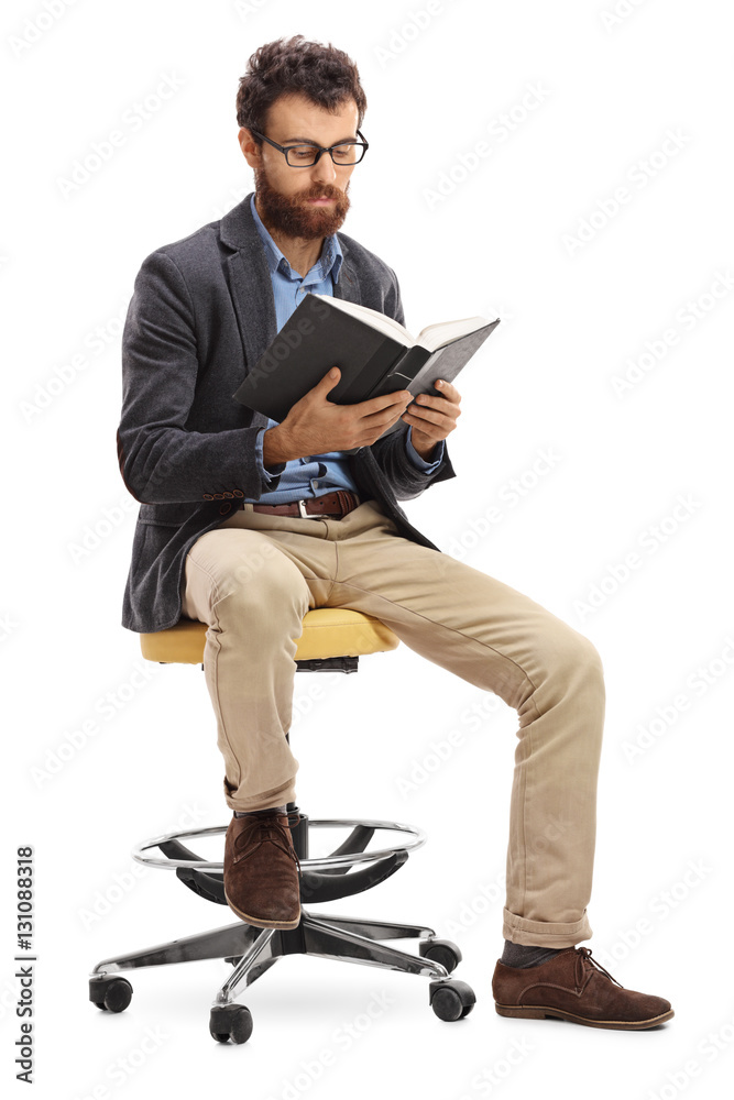 Poster Man sitting on a chair and reading a book