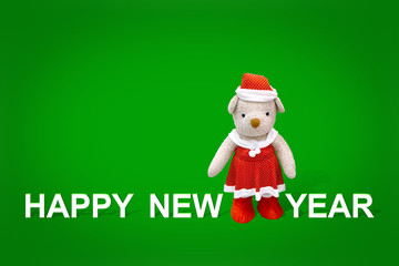 Merry christmas and happy new year card 2017 with pretty teddy bear in red dress and santa hat or santy costume standing between greetings wording.