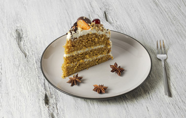 Carrot cake with cream cheese, nuts, berries and tangerines