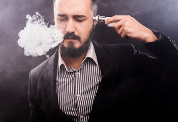 man in shirt vape mod near temple to commit suicide