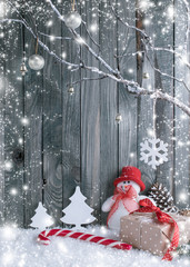 Christmas interior with snowman, decorative branches, presents a