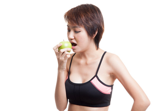 Beautiful Asian healthy girl eat apple.
