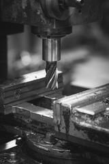 Milling machine for carving metal. Black and white image.
