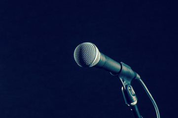 Microphone on dark background, music instrument concept