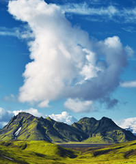 Travel to Iceland. Beautiful Icelandic landscape with mountains, sky and clouds. Trekking in...