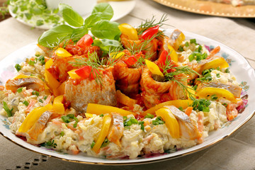 Rolled christmas herrings in tomato sauce