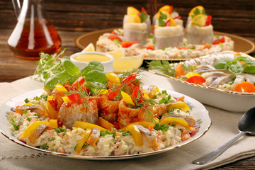Rolled christmas herrings in tomato sauce
