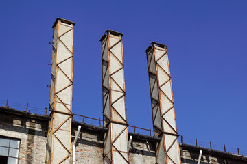 Fototapeta premium cement chimney of an ancient brick factory .old industrial area abandoned