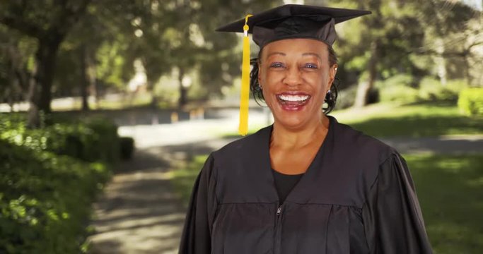 An older black woman graduating college. Portrait of an elderly black woman graduated university