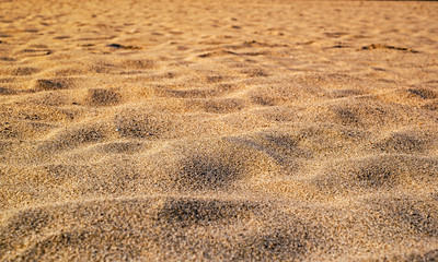 Sunset on the beach. Sand texture.