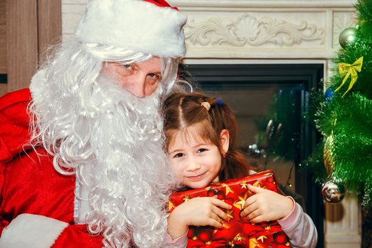 Santa Claus and little girl.