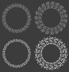 Round vector frames and wreaths made of different abstract elements drawn with black ink pen. Christmas and new year motifs and patterns. For design of frames, headers, banners, greeting cards.