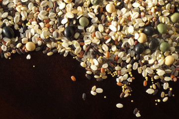 Fototapeta premium Cereals and beans on wood background