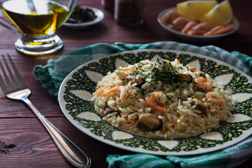 Risotto with shrimps on a green plate