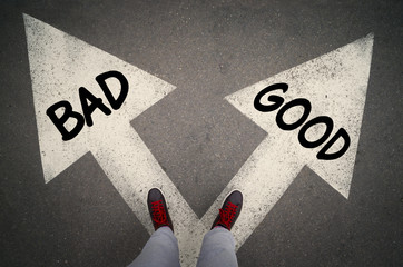 GOOD versus BAD written on the white arrows, dilemmas concept.