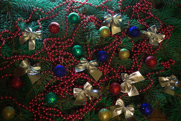 Christmas tree branch with ribbons and beads