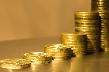stack of coins and progression/ progression of growing wealth