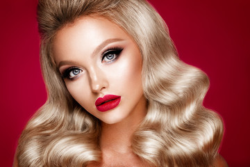 Beautyful girl with bright make up and beautiful hairstyle. Red lips