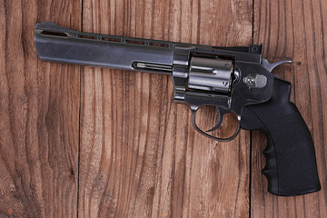 revolver gun on a wooden table