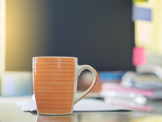 clay cup is placed on a desk At noon.  Break time concept.