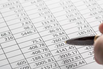 Close up of finance business sheet with pen