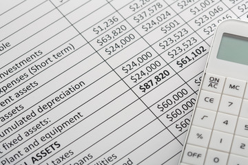 Close up of finance business sheet with calculator