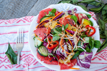 Bright vegetable salad with grapefruit, orange and avocado. Perfect for the detox diet or just a healthy meal.  Love for a healthy raw food concept.