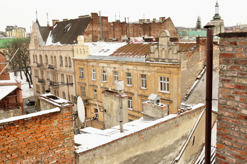 Old buildings and snow-covered roofs of the downtown in Lviv, Ukraine.