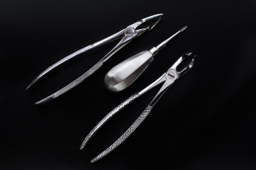 Set of metal dental tools for tooth extraction