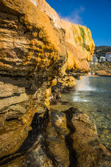 Scenic thermal waterfalls  on  beach in Loutro Edipsou, Evia, Gr © siete_vidas1