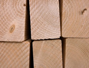 a close up of a pile wooden beams