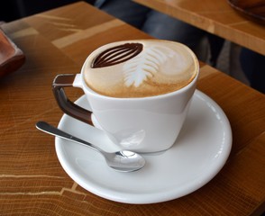 Delicious Foamy Italian Cappuccino On A Cup On A Table