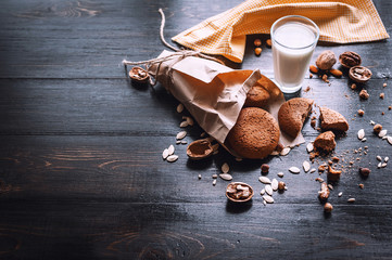 cookies with milk on a wooden table