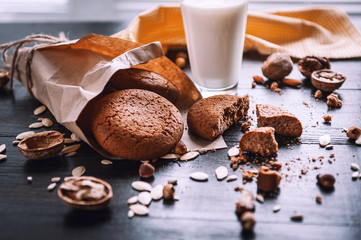 cookies with milk on a wooden table