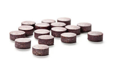 herbal pills on white background