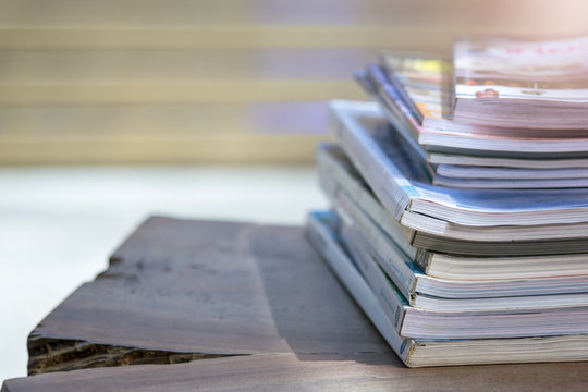 Stack tank of old books on a wooden table
