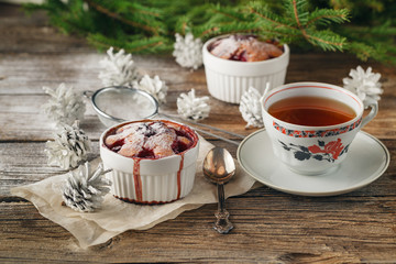 Cranberry cake with icing on festive christmas table.