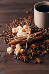 Composition  cup with coffee beans on black background