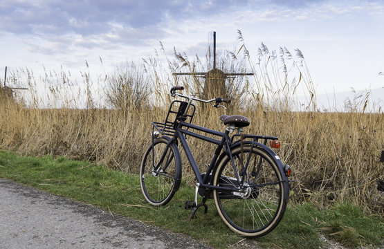 old type of bike and windmill