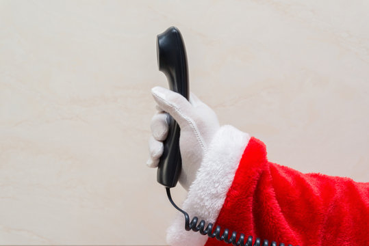 Santa Claus holding a telephone receiver