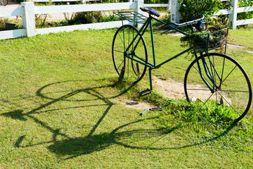 Vintage bike on grass with shadow