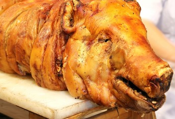 roast pork with the big nose in the rotisserie